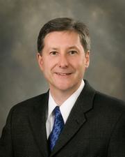 Chris G. Mazzini, President, CEO, and Chairman of the Board